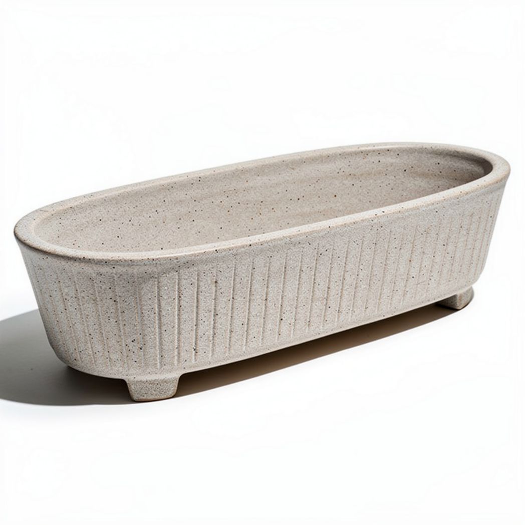 Lange ovale plantenbak van speckled cement met afmetingen 60 x 25 x 15cm